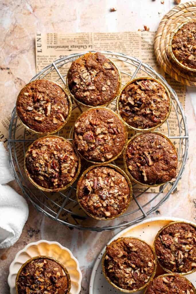 Baked pecan pie muffins cooling on a wire rack