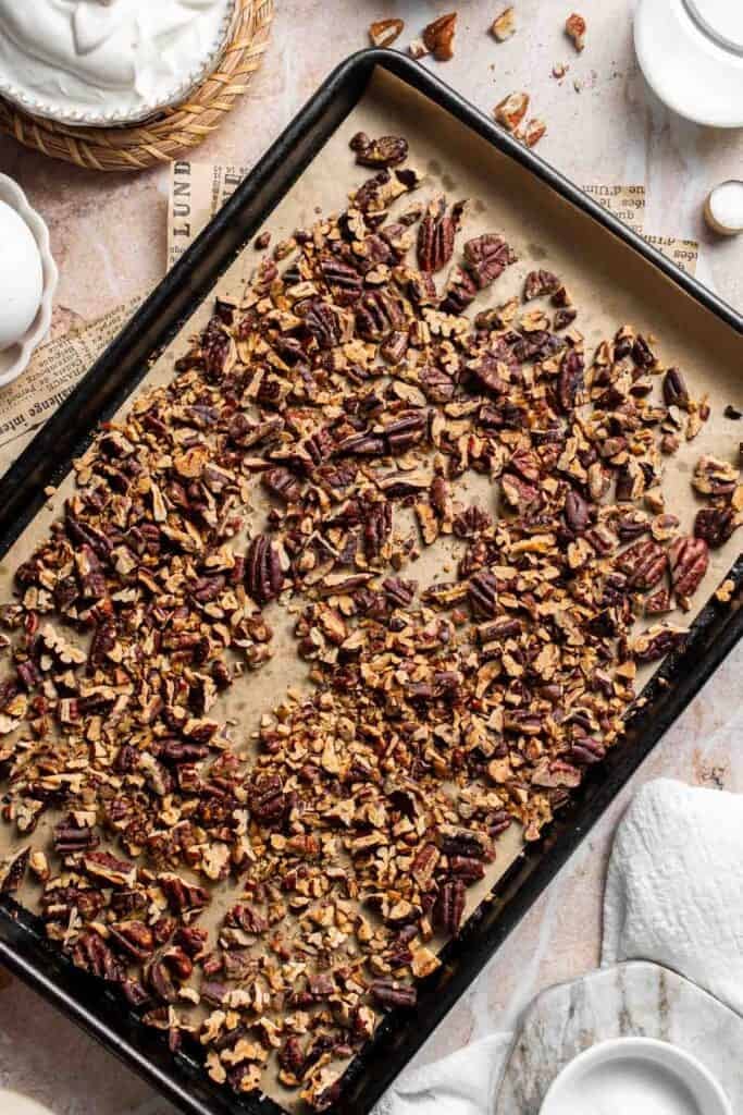 Toasted pecans on a baking sheet, fragrant and lightly browned