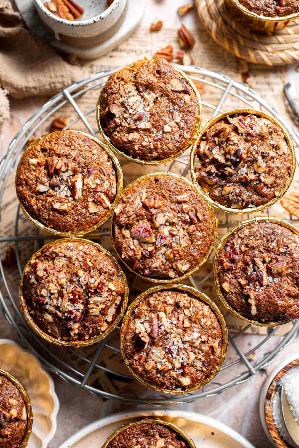 Overhead view of pecan pie muffins cooling on a wire rack