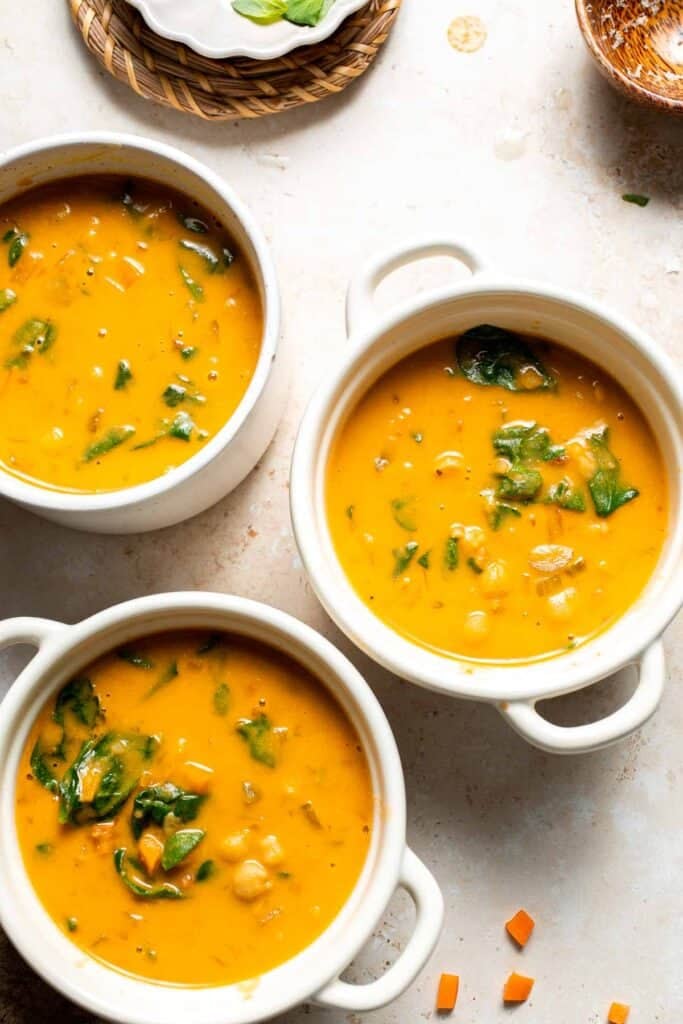 Overhead view of Tuscan chickpea soup ladled into serving bowls
