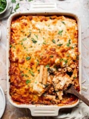 Baked vegetarian ziti with melted, golden brown cheese on top