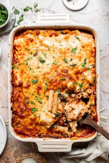 Baked vegetarian ziti with melted, golden brown cheese on top