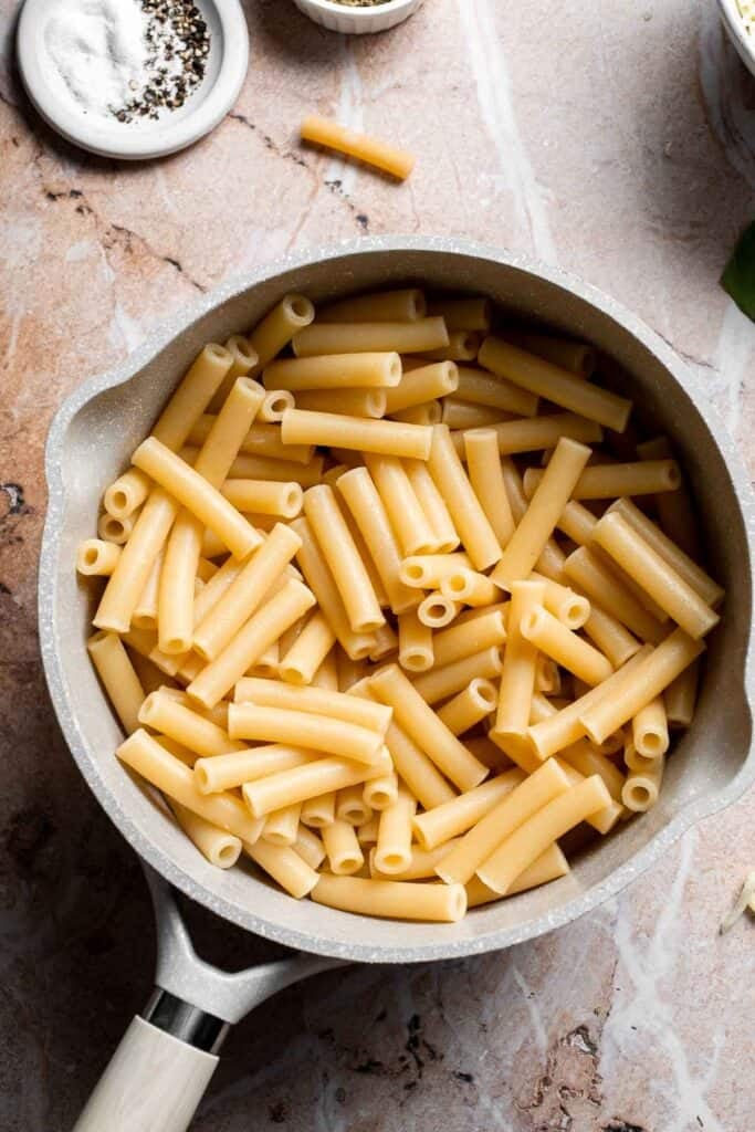 Ziti pasta cooked and drained in a pot