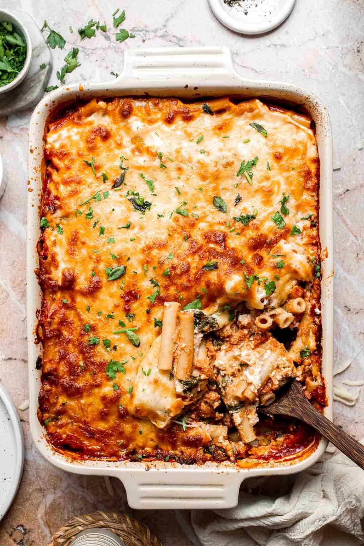 Baked vegetarian ziti with melted, golden brown cheese on top
