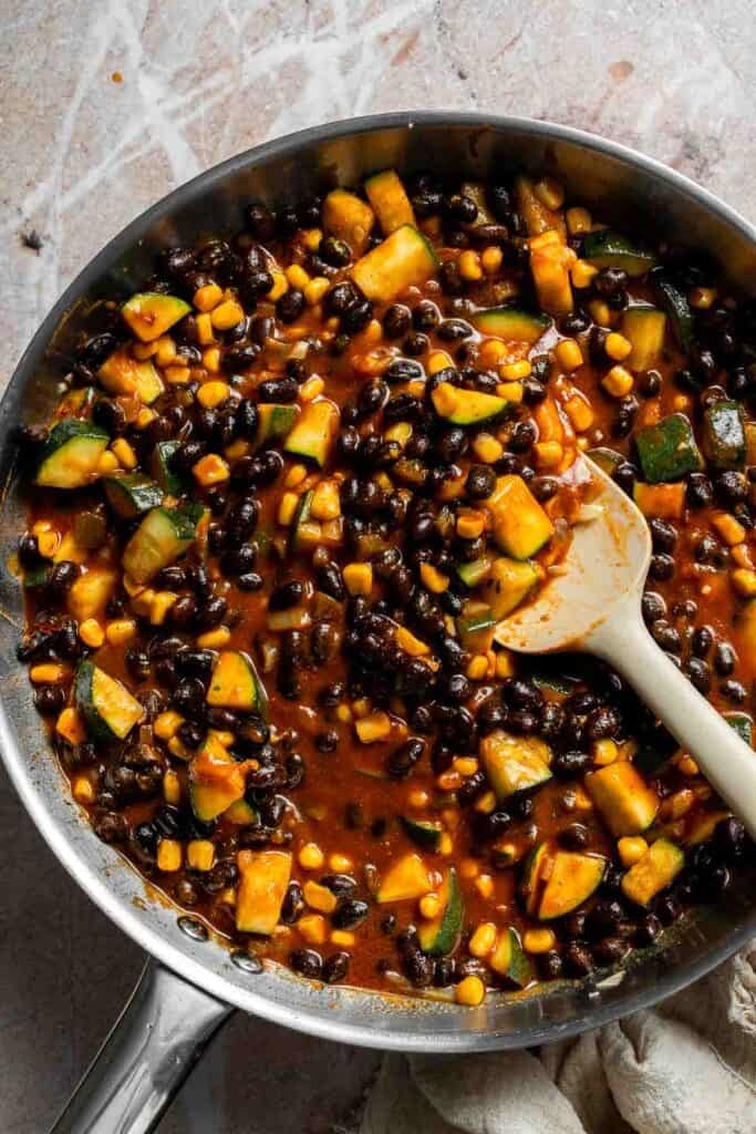 Finished vegetarian enchilada filling in a skillet