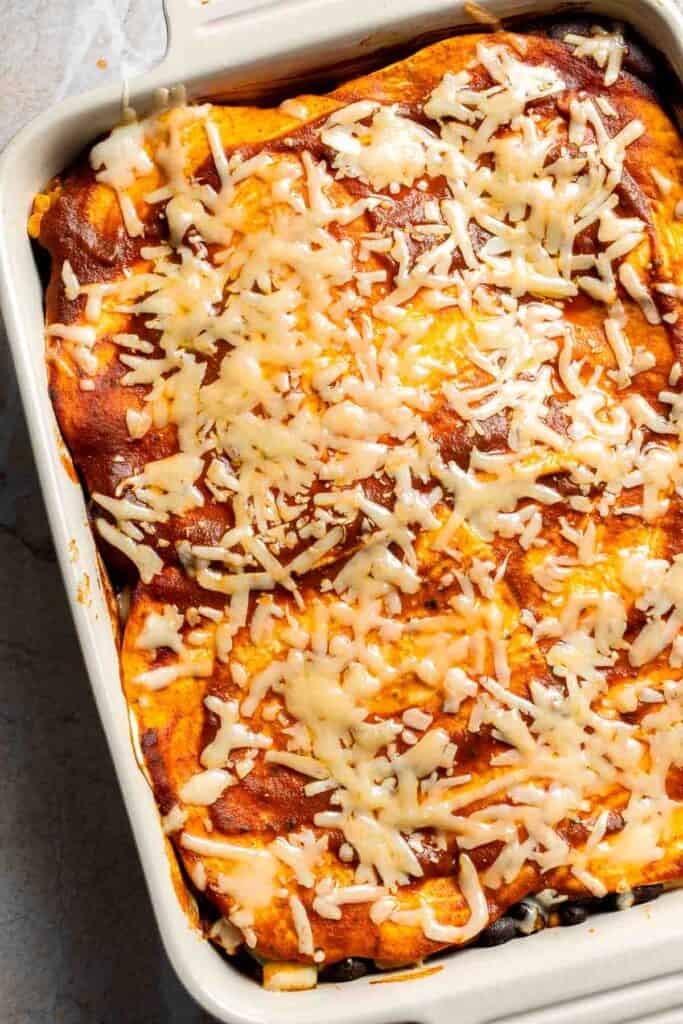 Vegetarian enchilada casserole ready to go back into the oven after aluminum foil removed