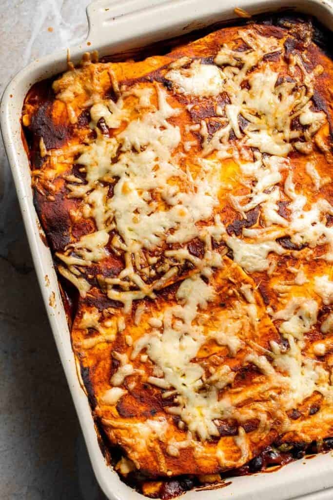 Baked vegetarian enchilada casserole with melted, bubbly cheese