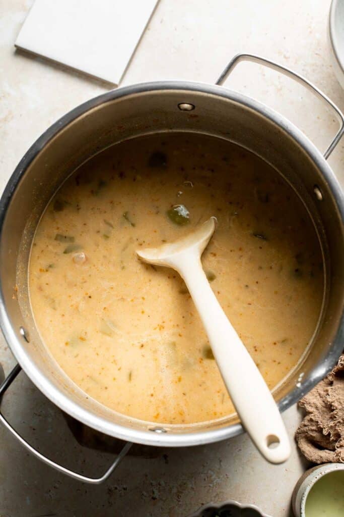Creamy blended chili stirred together in the pot.