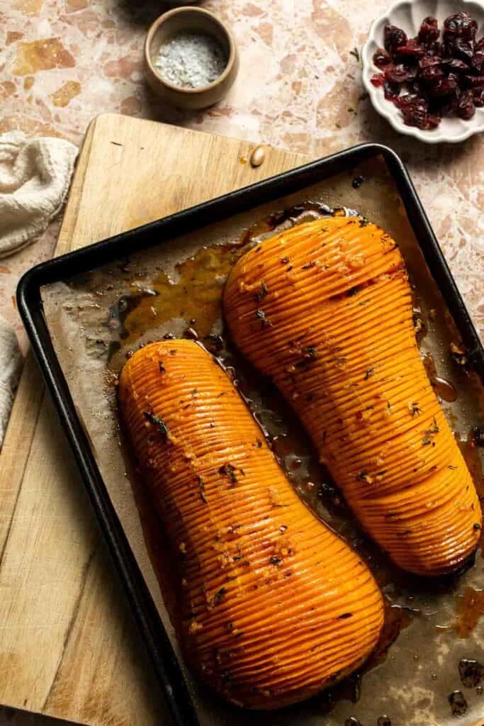Hasselback butternut squash brushed with maple butter before finishing in the oven.