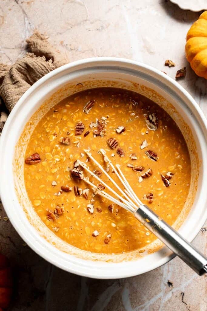 Chopped pecans added into pumpkin oatmeal batter