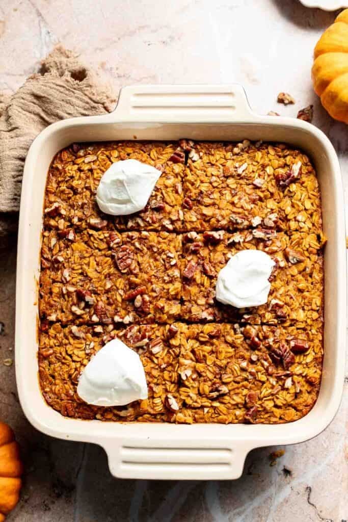Baked pumpkin oatmeal topped with dollops of Greek yogurt