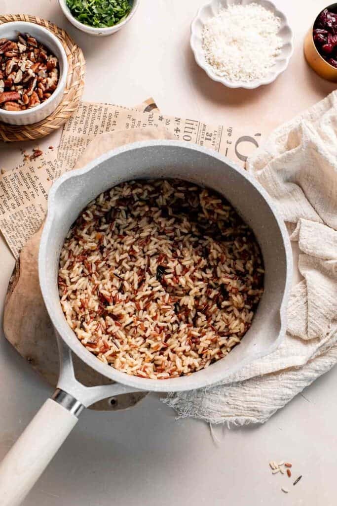 Cooked wild rice blend in a saucepan.