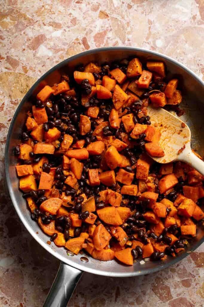 Sweet potato and black bean filling mixed together in the skillet.