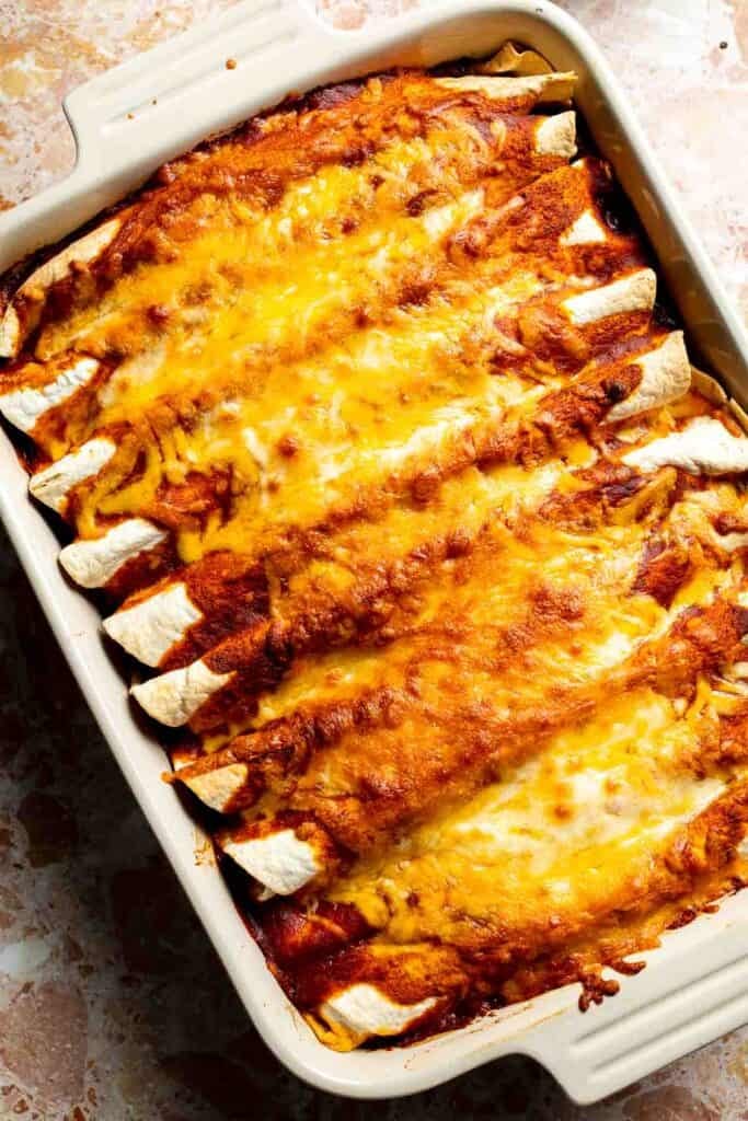 Baked sweet potato black bean enchiladas with melted, bubbly, golden cheese.