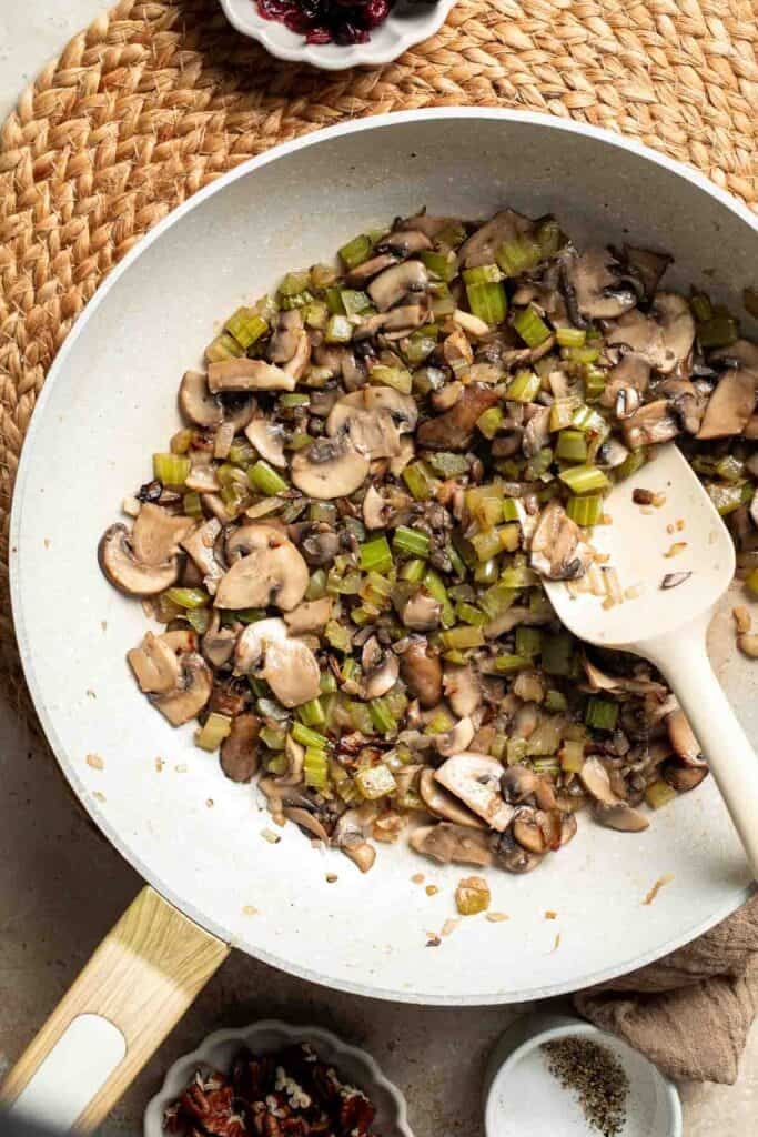 Mushrooms, onion, and celery cooked down until browned in the skillet.