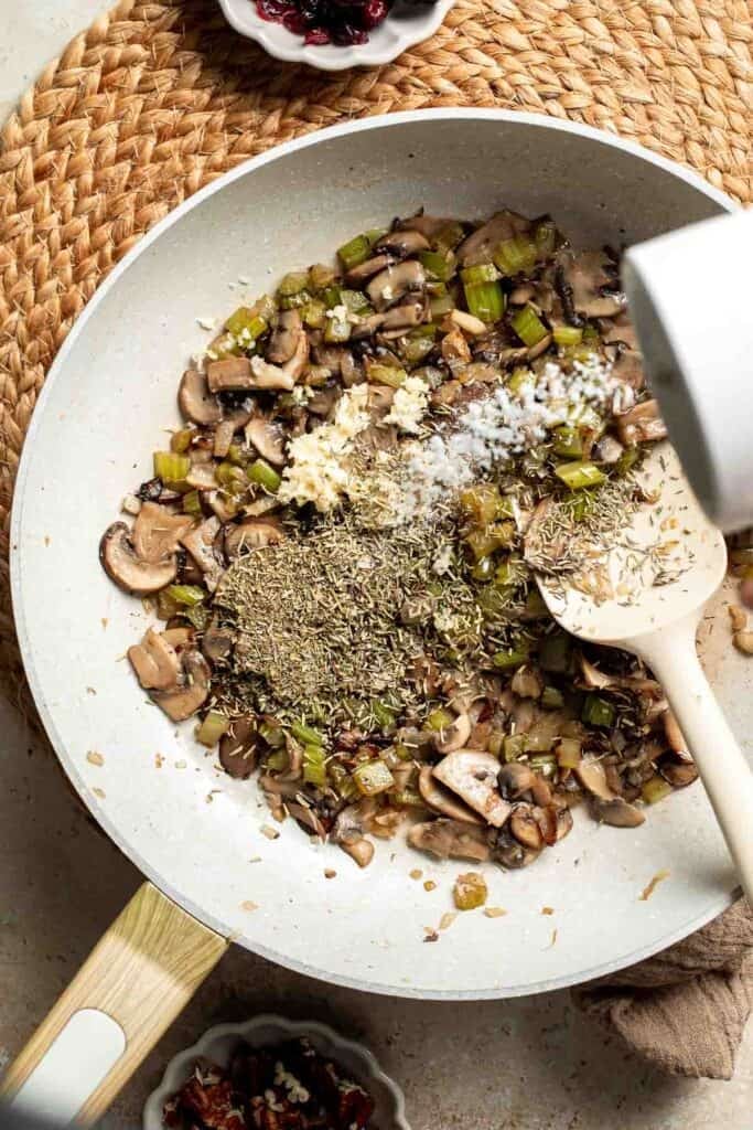 Salt and pepper sprinkled over the sautéed mushrooms and vegetables.
