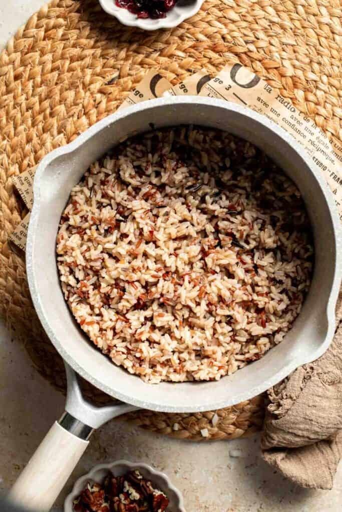 Cooked wild rice blend in the saucepan, tender and ready to use.