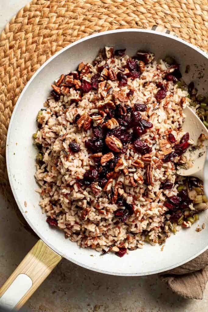 Dried cranberries and chopped pecans added on top of the stuffing in the skillet.